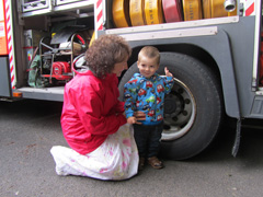 Boy in front of a fire engine